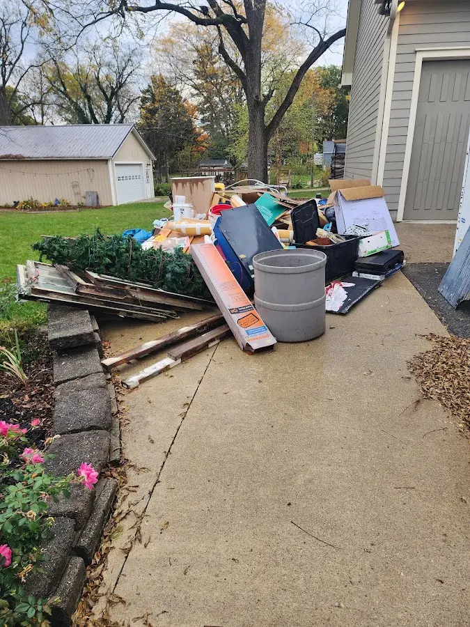 Dumpster being loaded with debris for Residential Dumpster Rental in Latimer